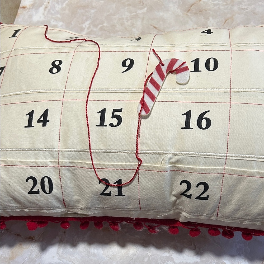 Festive Countdown Pillow with Red and Cream Design